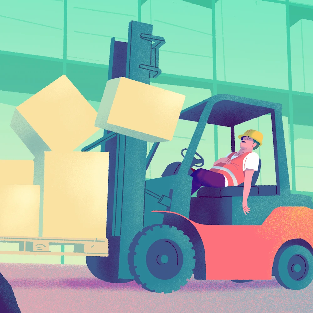 A warehouse worker suffering from fatigue at work in a warehouse.
