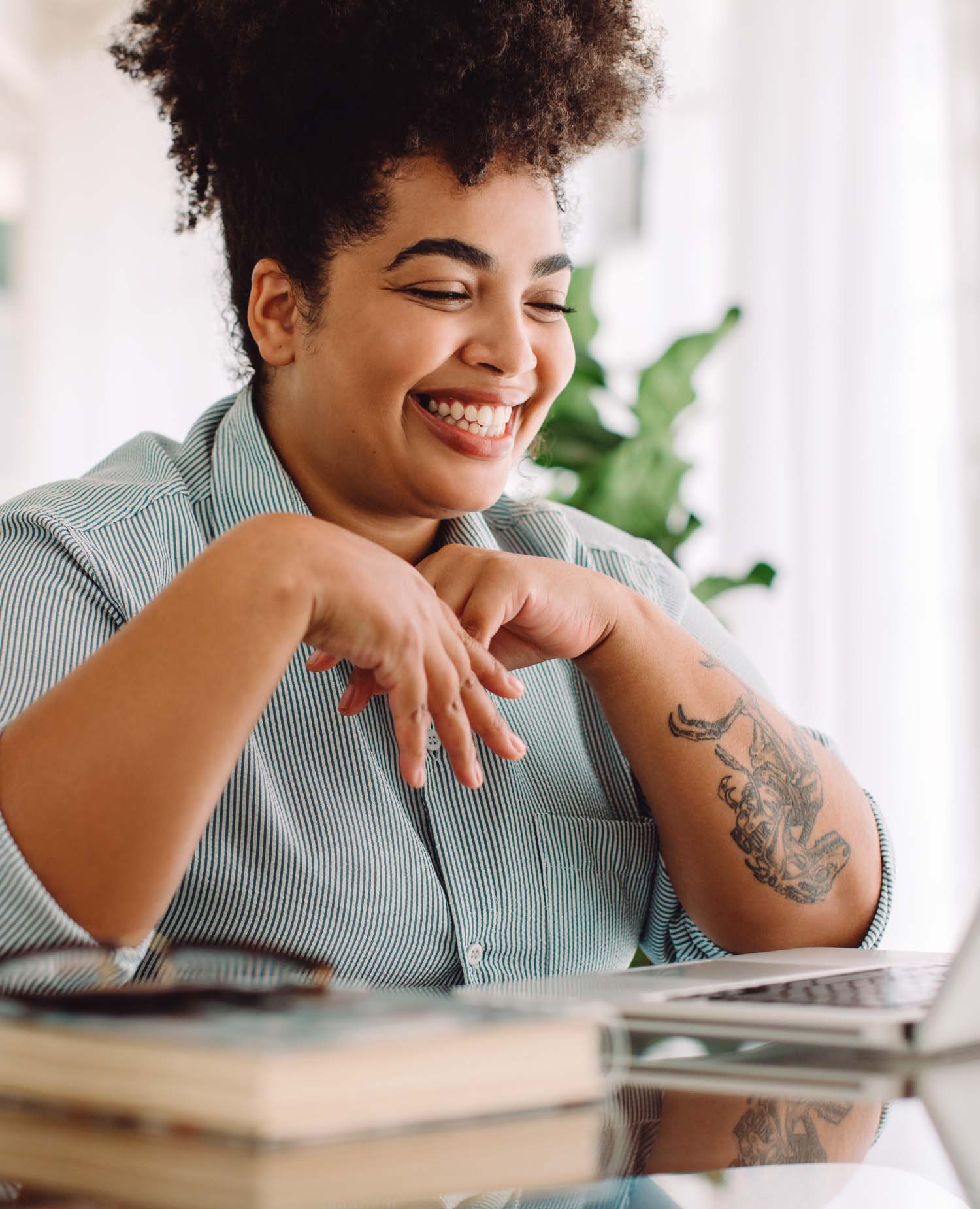 Woman smiling in front of her computer