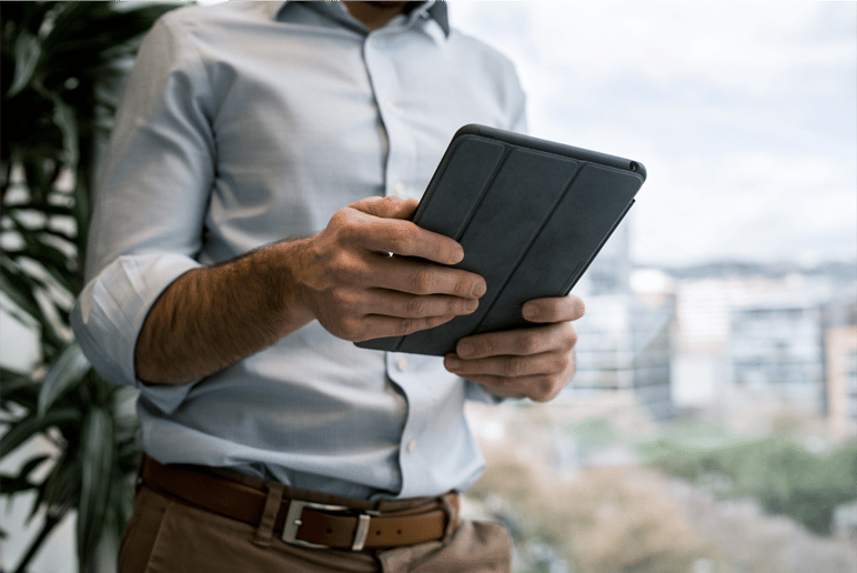 Man holding a tablet representing how easy it is to punch with a tablet using Agendrix