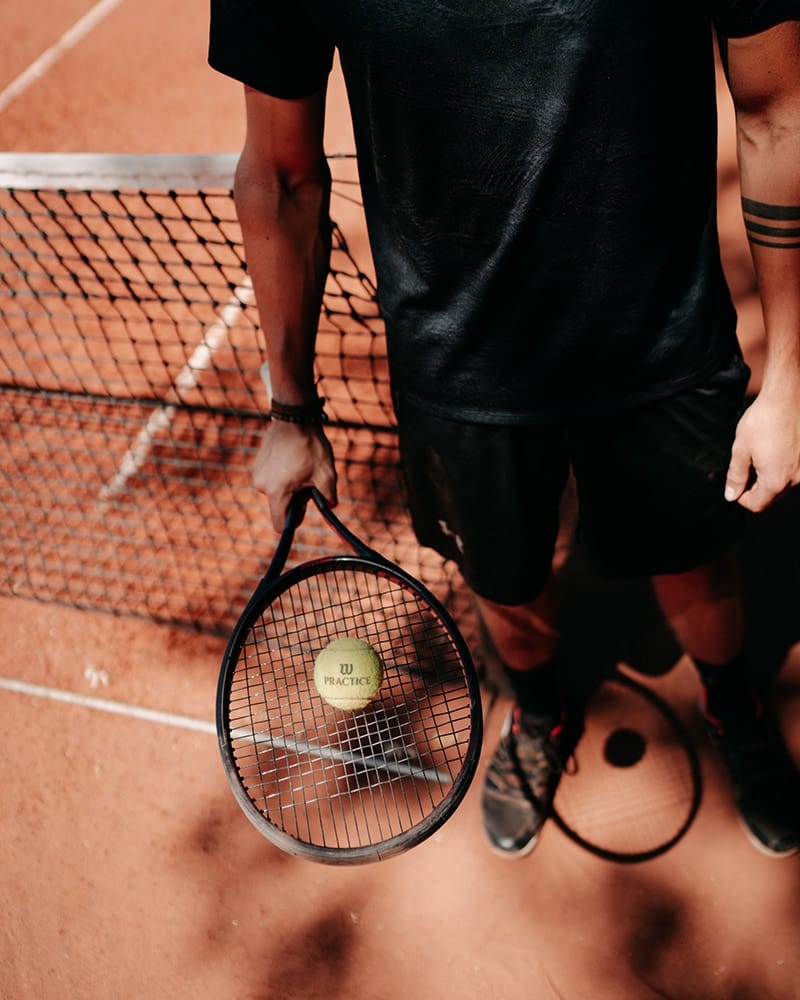 Young man playing tennis outdoor