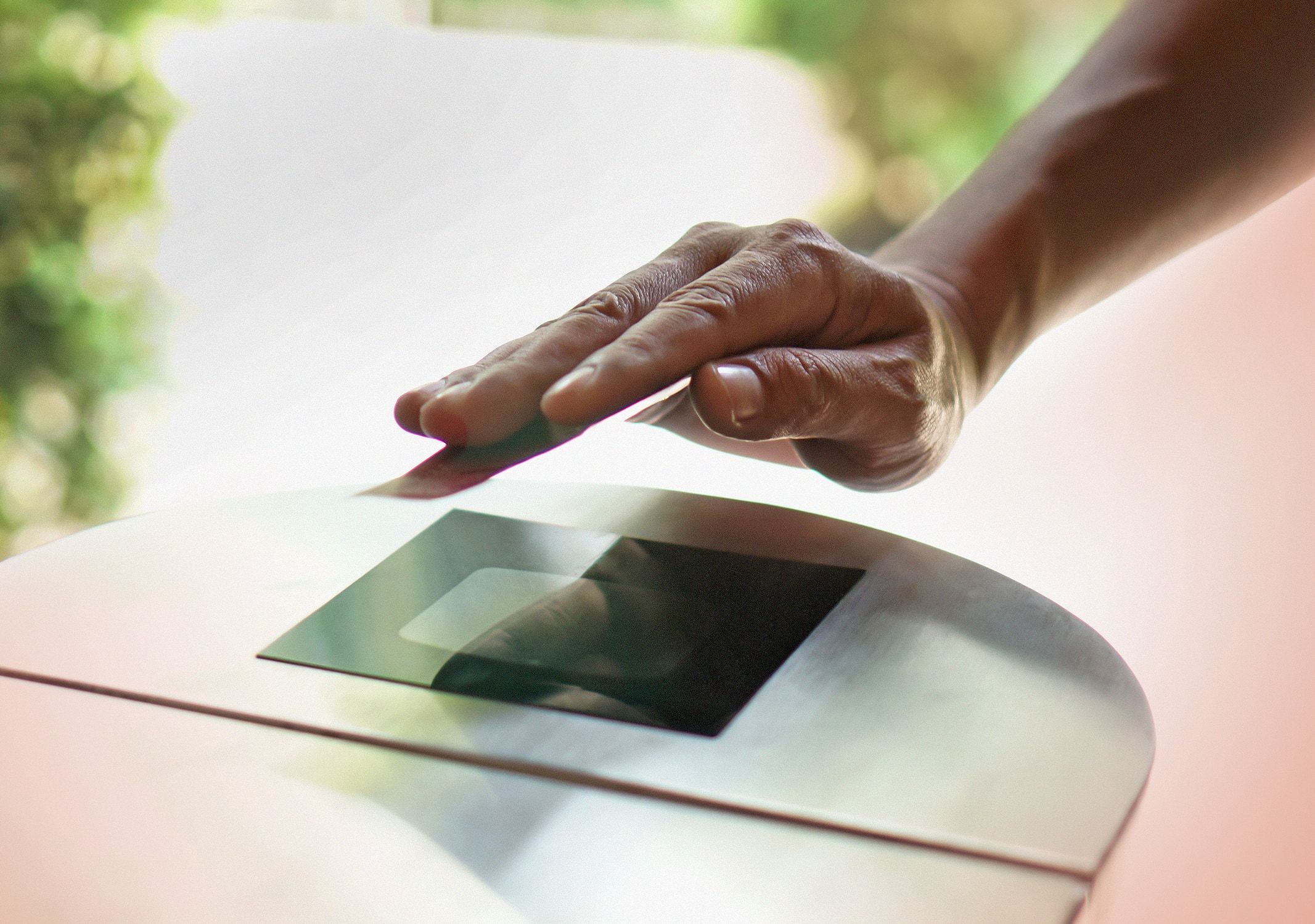 Hand holding a RFID card and punching