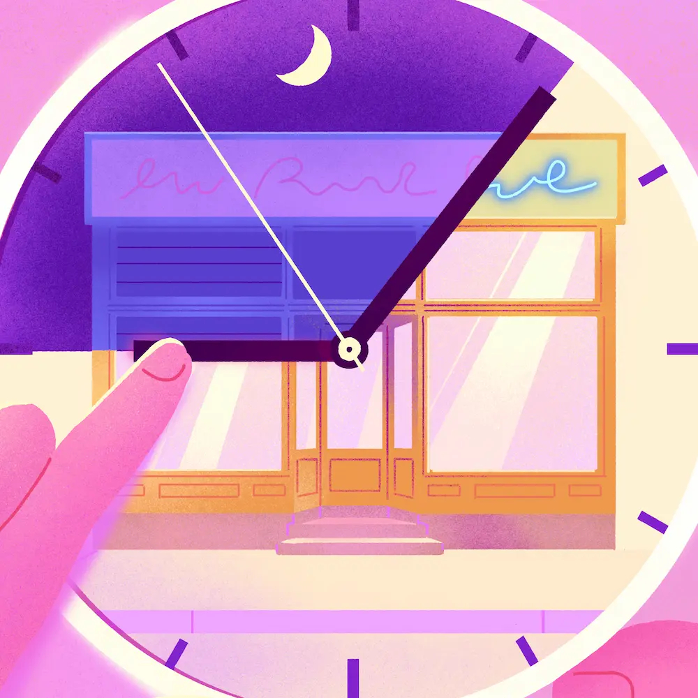 Hand adjusting a clock displaying a retail store at night, illustrating extended store hours