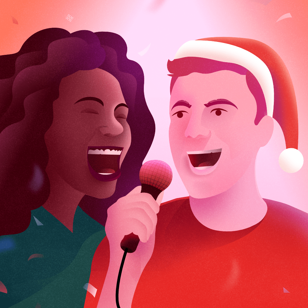woman and man wearing a Santa hat singing in a microphone