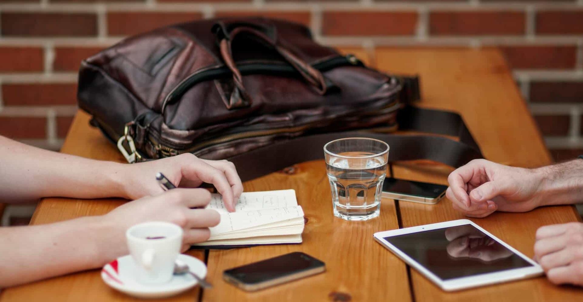 Manager interviewing a candidate in a coffee shop