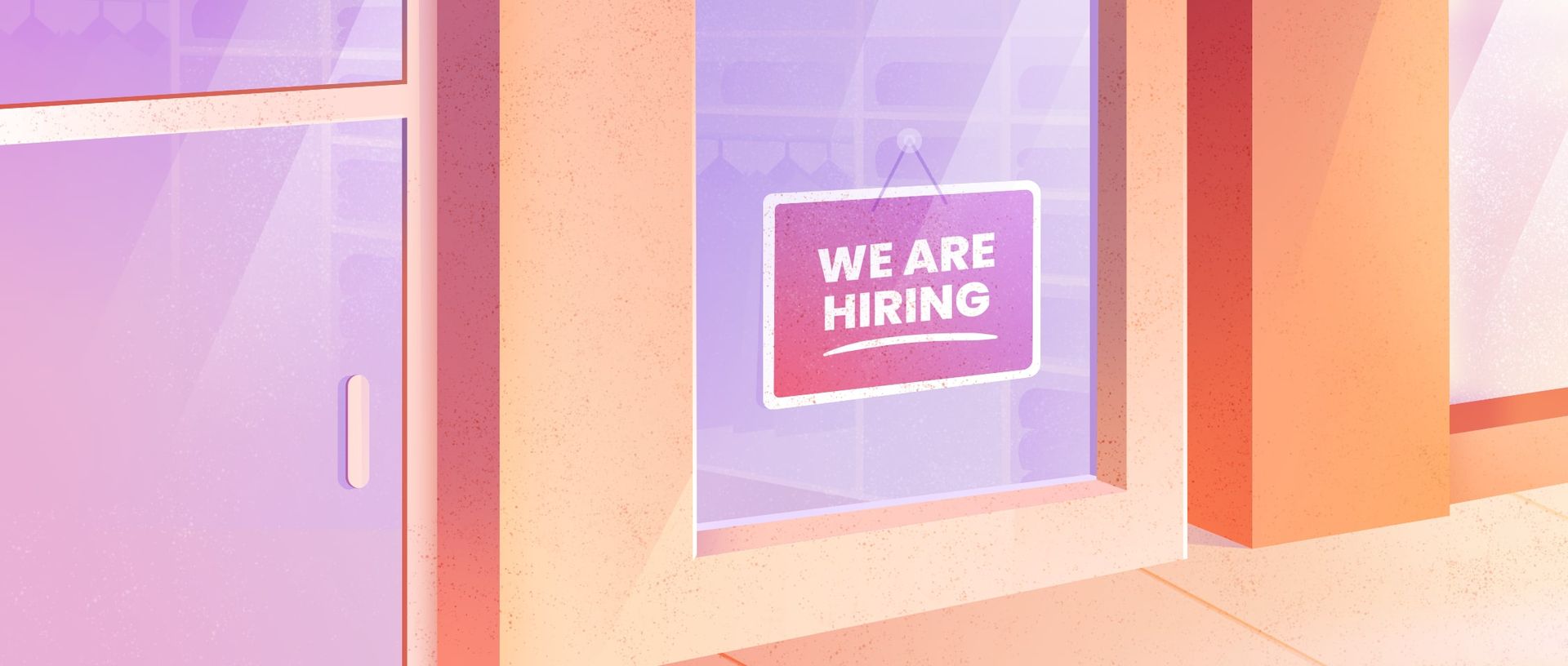 Window of a retail store with a help we are hiring sign
