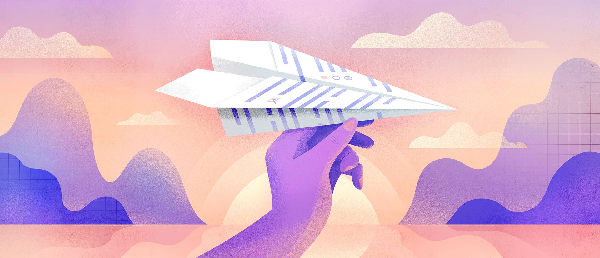 Main qui tient un avion en papier avec un coucher de soleil et des montagnes en arrière-plan