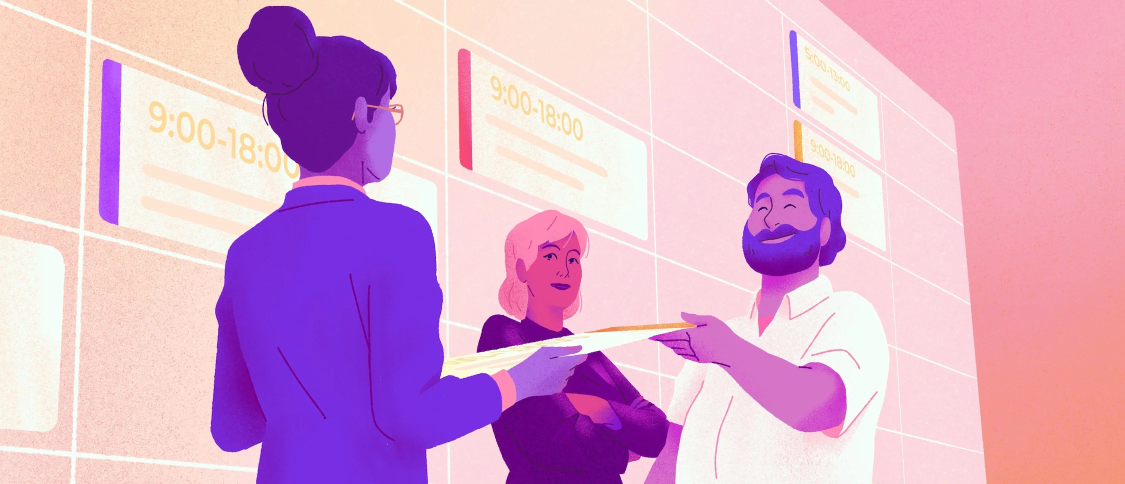 Une femme remet un papier à un homme barbu qui est debout à côté d'une autre femme et d'un planning de travail mural.